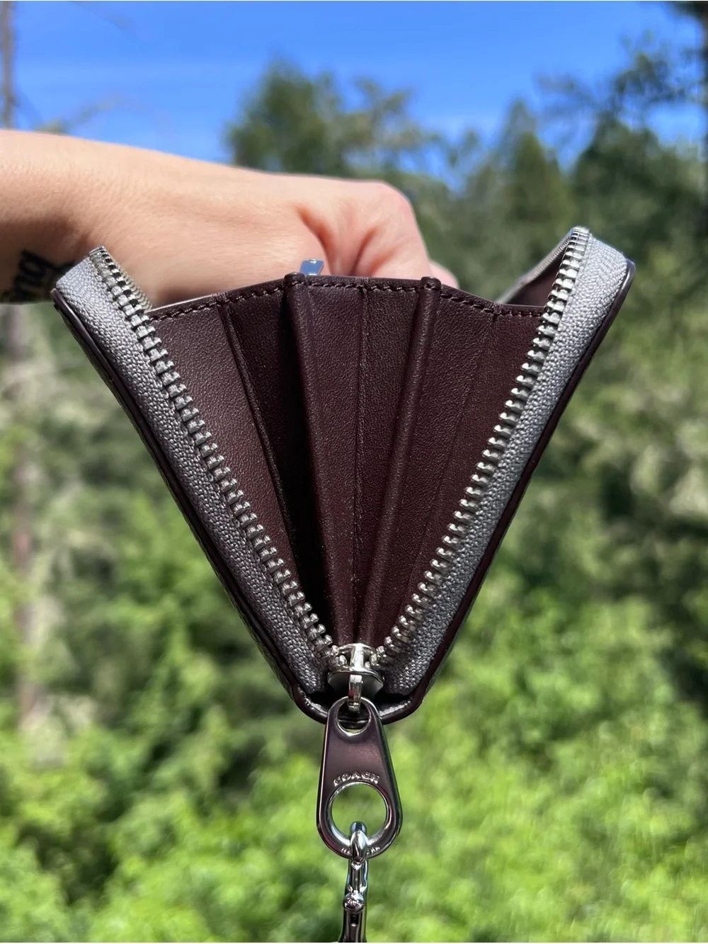 Coach accordion zip